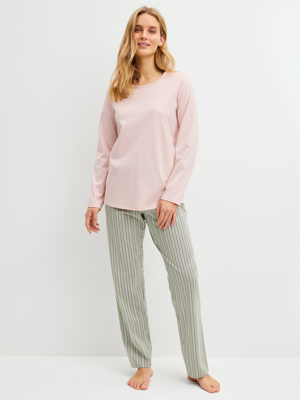 Women model is wearing Pyjamas, long made of 100% Cotton in Green, Striped from the Cotton Special series by CALIDA, Front view