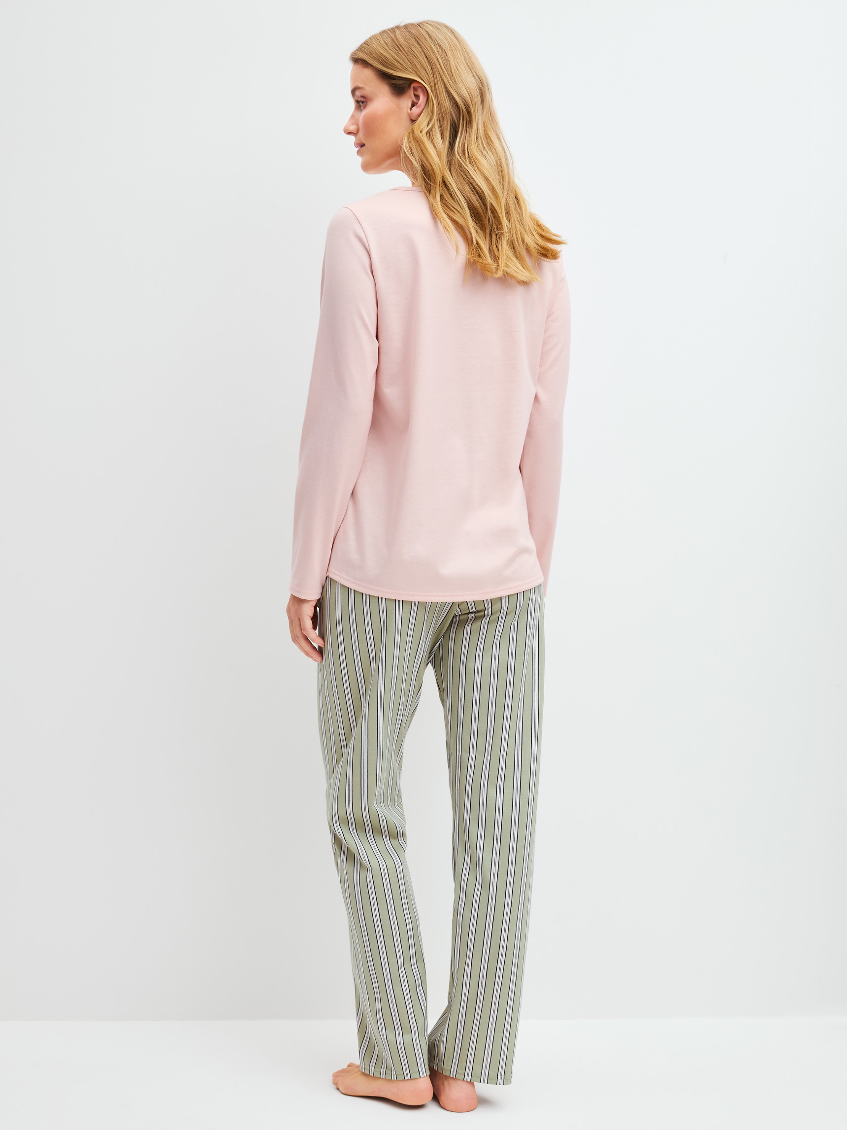 Women model is wearing Pyjamas, long made of 100% Cotton in Green, Striped from the Cotton Special series by CALIDA, Back view