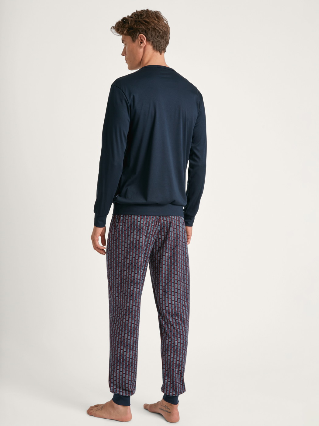 Men model is wearing Pyjama with cuff made of 100% Cotton in Blue, Striped from the Relax Streamline 5 series by CALIDA, Back view