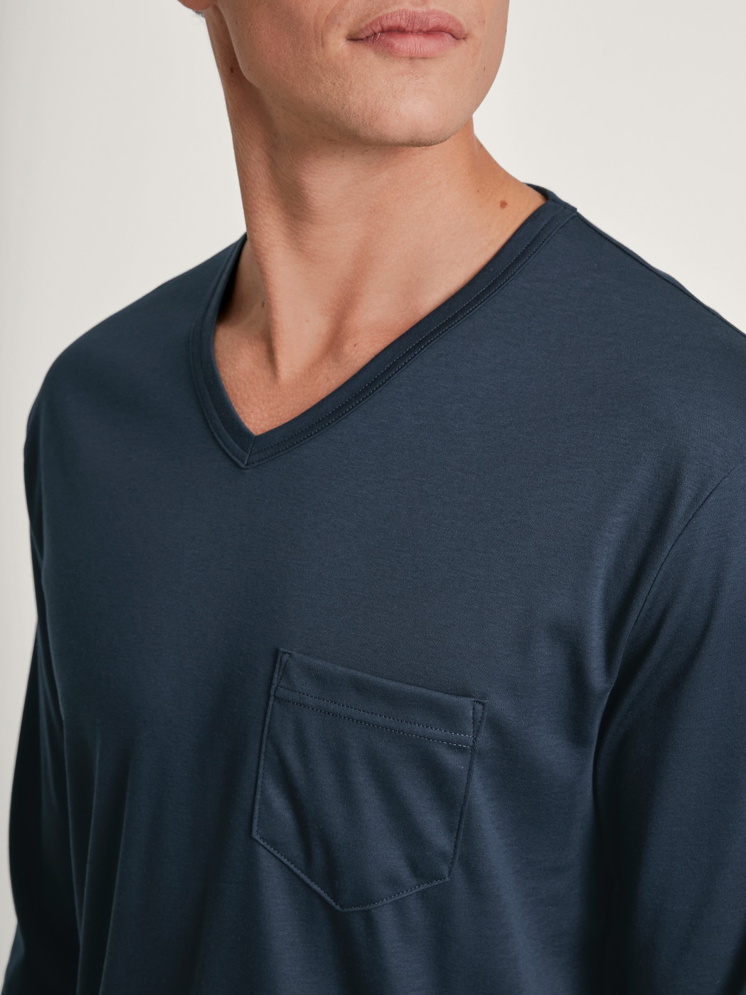 Men model is wearing Pyjama with cuff made of 100% Cotton in Blue, Striped from the Relax Streamline 5 series by CALIDA