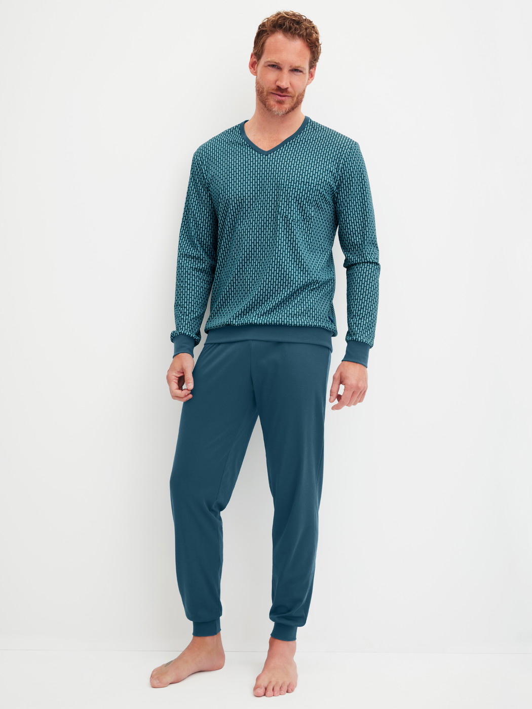 Men model is wearing Pyjama with cuff made of 100% Cotton in Turquoise, Patterned from the Relax Streamline 1 series by CALIDA, Front view