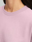 Women model is wearing Pyjama with cuff made of 100% Cotton in Purple, Patterned from the Blooming Nights series by CALIDA, Detail