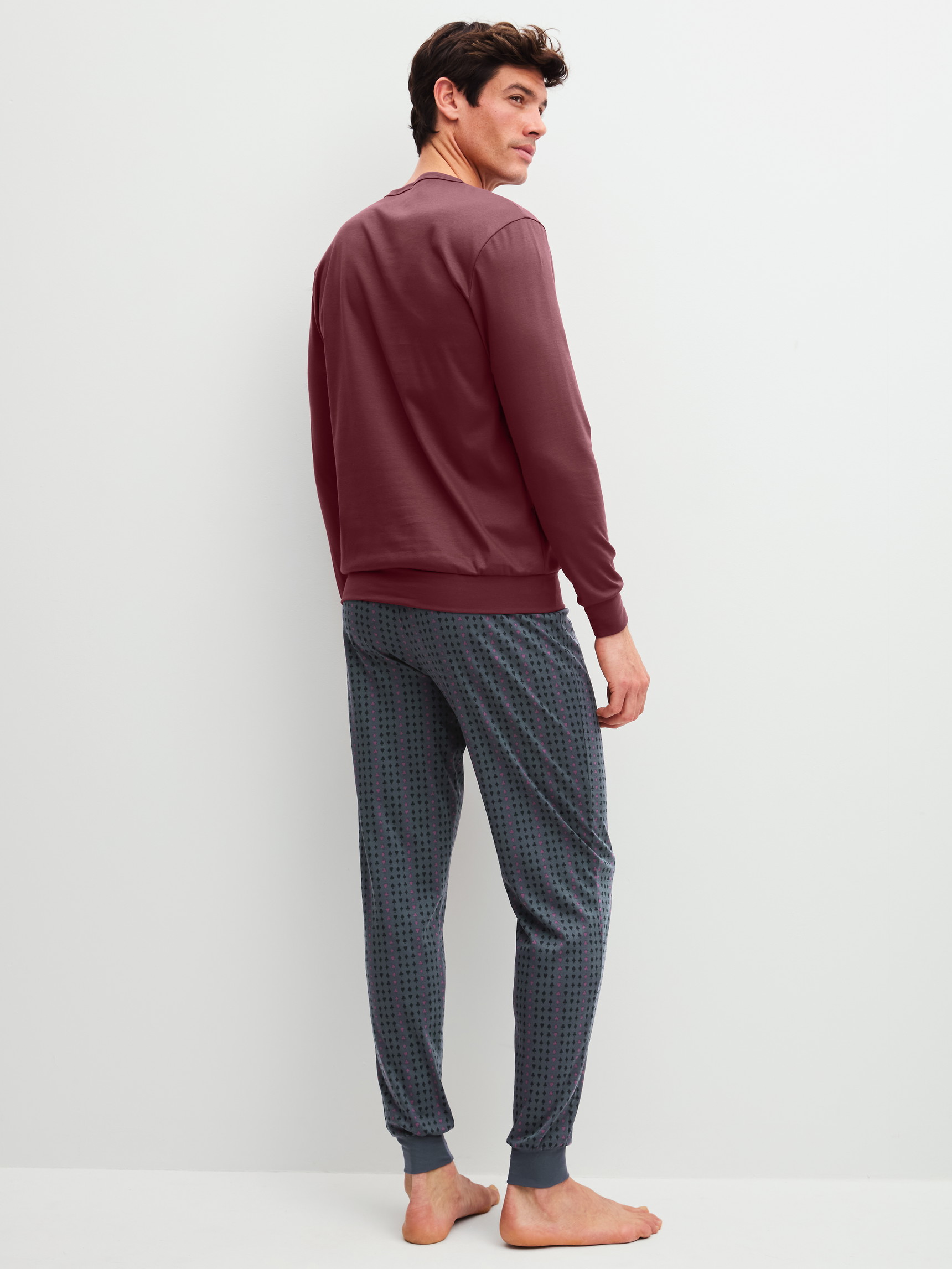 Men model is wearing Pyjama with cuff made of 100% Cotton in Red, Striped from the Relax Streamline 4 series by CALIDA, Back view