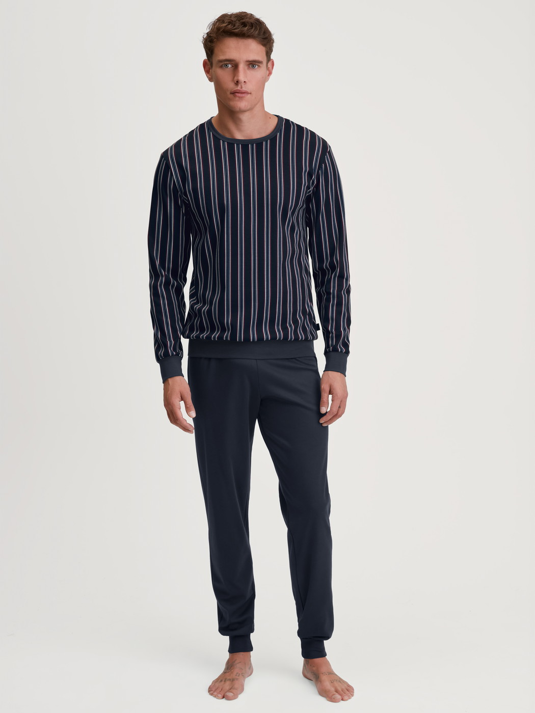 Men model is wearing Pyjama with cuff made of 100% Cotton in Blue, Striped from the Relax Streamline 4 series by CALIDA, Front view