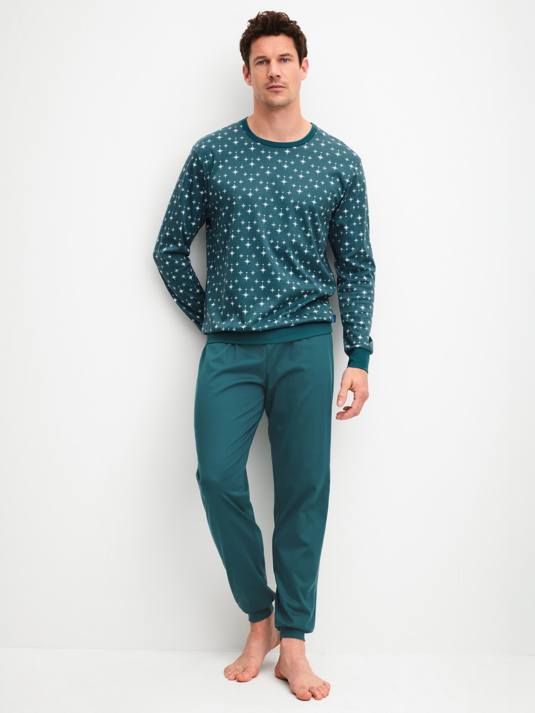 Men model is wearing Pyjama with cuff made of 100% Cotton in Turquoise, Patterned from the Relax Streamline 3 series by CALIDA, Front view