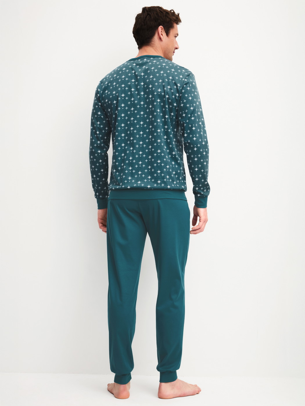 Men model is wearing Pyjama with cuff made of 100% Cotton in Turquoise, Patterned from the Relax Streamline 3 series by CALIDA, Back view