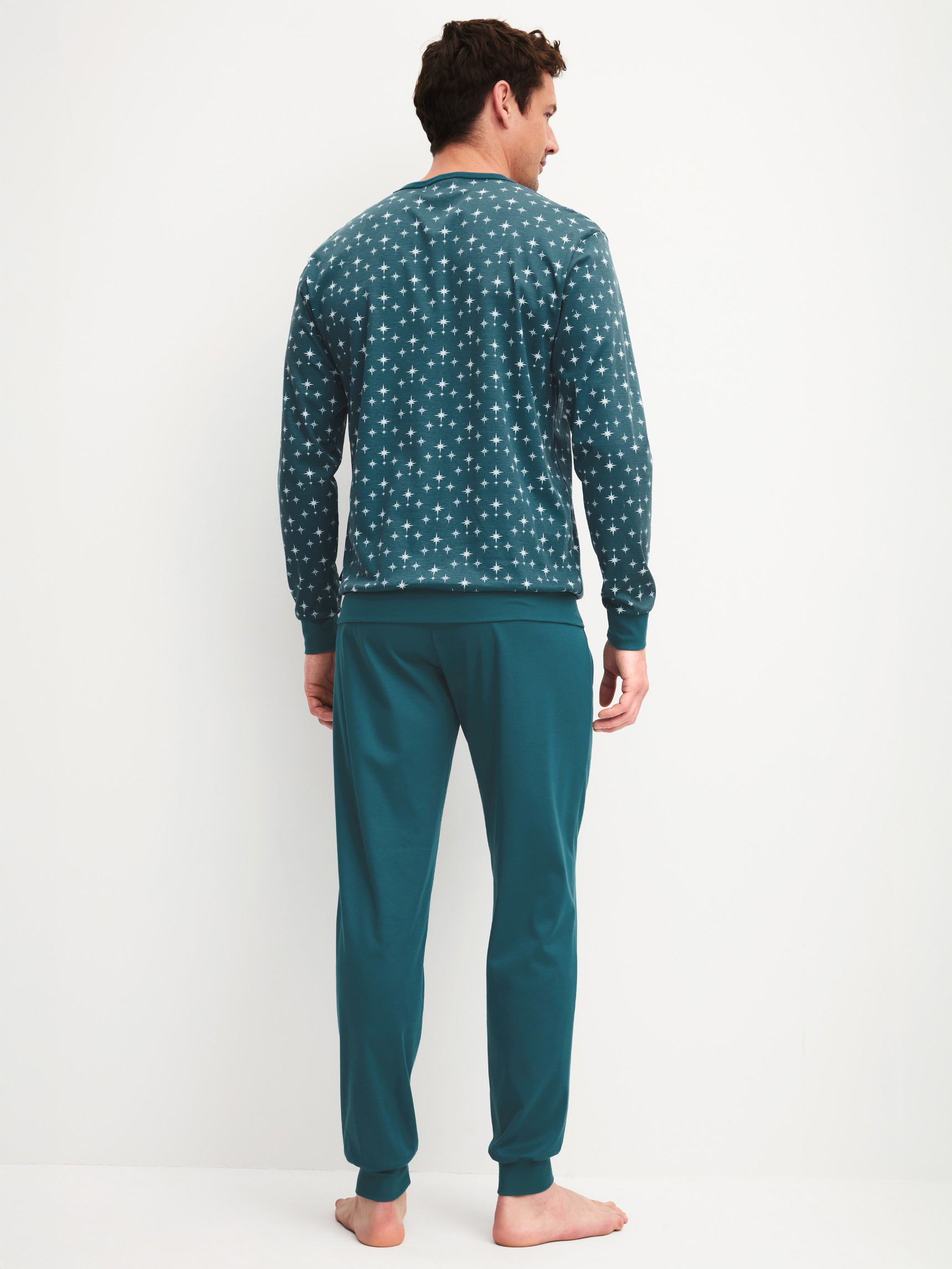 Men model is wearing Pyjama with cuff made of 100% Cotton in Turquoise, Patterned from the Relax Streamline 3 series by CALIDA, Back view