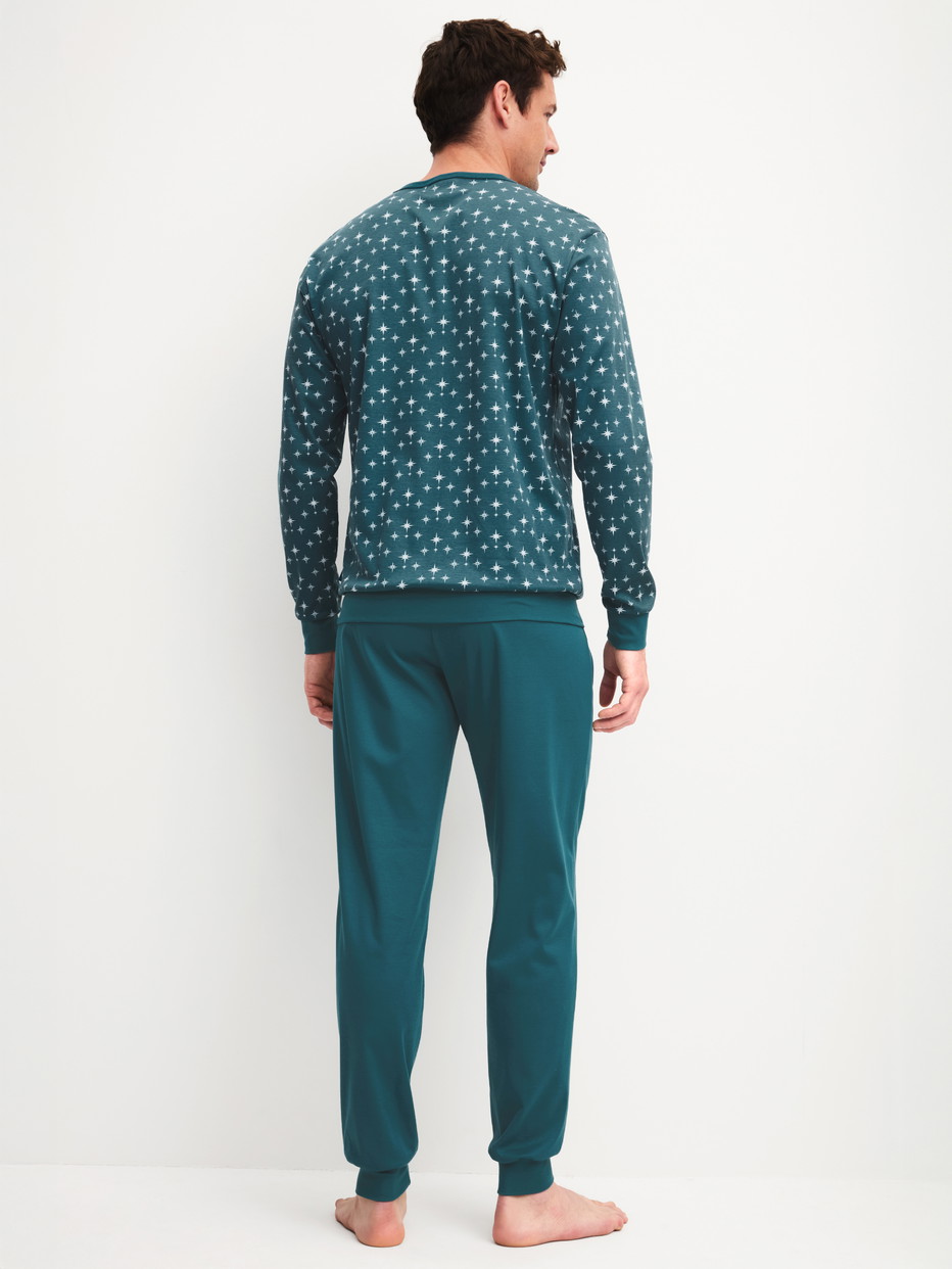 Men model is wearing Pyjama with cuff made of 100% Cotton in Turquoise, Patterned from the Relax Streamline 3 series by CALIDA, Back view