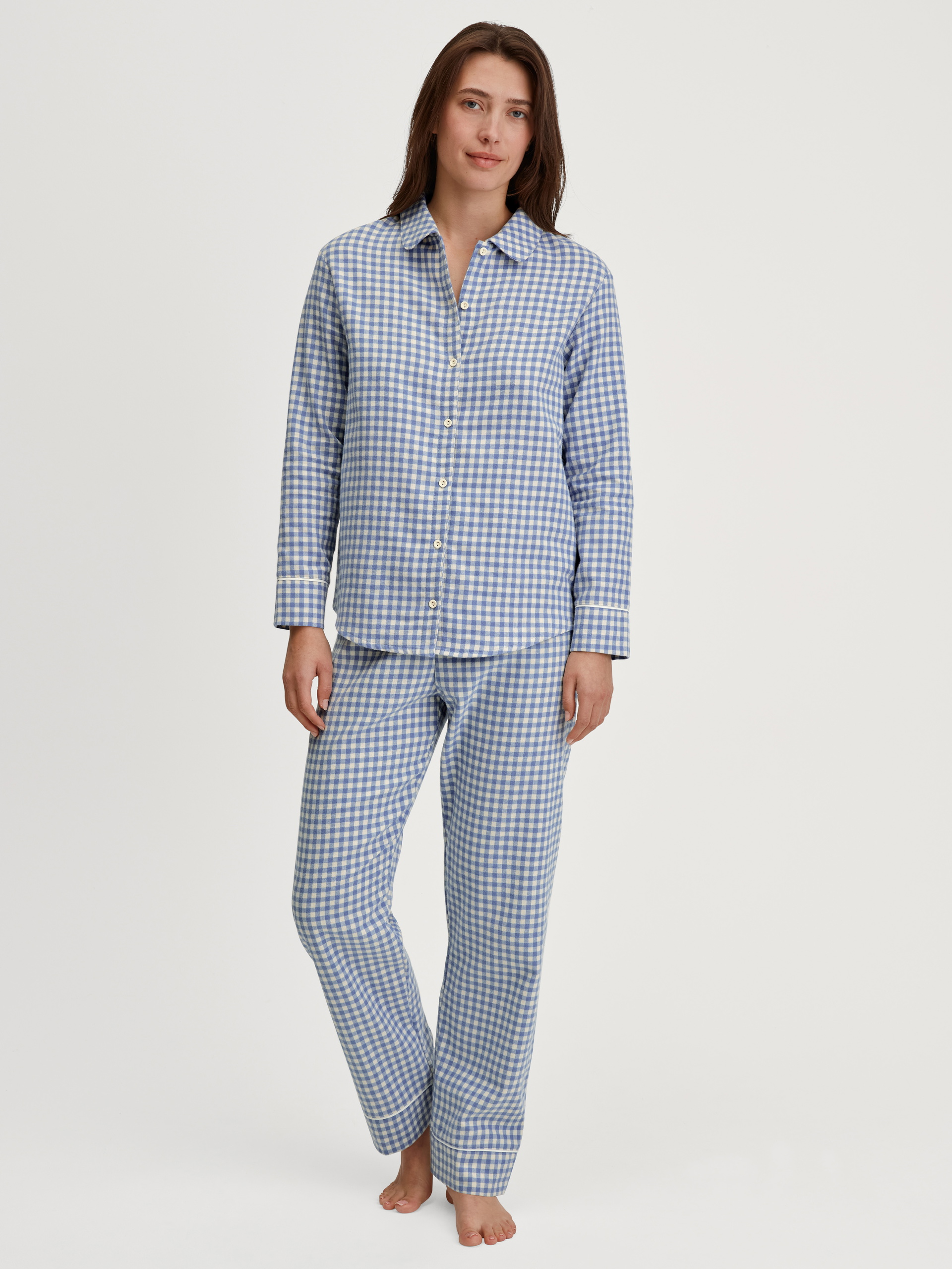 Women model is wearing Flannel pyjamas, buttoned made of 100% Cotton in Blue, Checked from the Flannel Dreams series by CALIDA, Front view