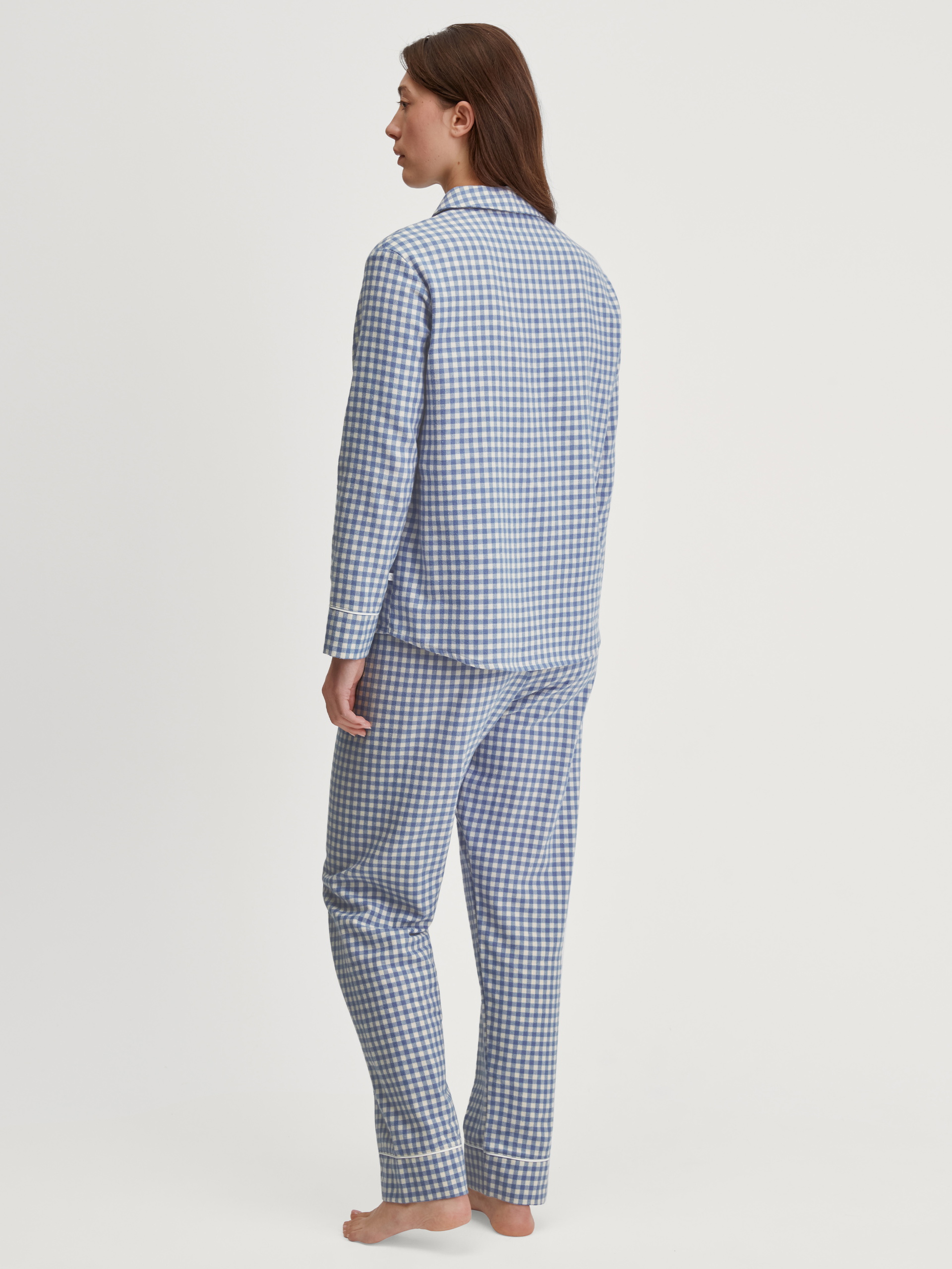 Women model is wearing Flannel pyjamas, buttoned made of 100% Cotton in Blue, Checked from the Flannel Dreams series by CALIDA, Back view