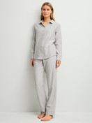 Women model is wearing Flannel pyjamas, buttoned made of 100% Cotton in Blue, Unicoloured from the Flannel Dreams series by CALIDA, Front view