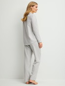 Women model is wearing Flannel pyjamas, buttoned made of 100% Cotton in Blue, Unicoloured from the Flannel Dreams series by CALIDA, Back view