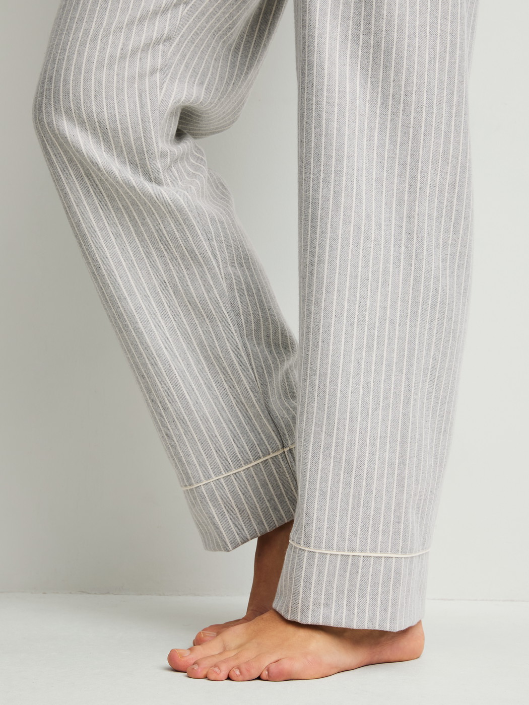 Women model is wearing Flannel pyjamas, buttoned made of 100% Cotton in Blue, Unicoloured from the Flannel Dreams series by CALIDA, Detail