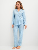 Women model is wearing Pyjama buttoned made of 100% Cotton in Blue, Patterned from the Lovely Nights series by CALIDA, Front view