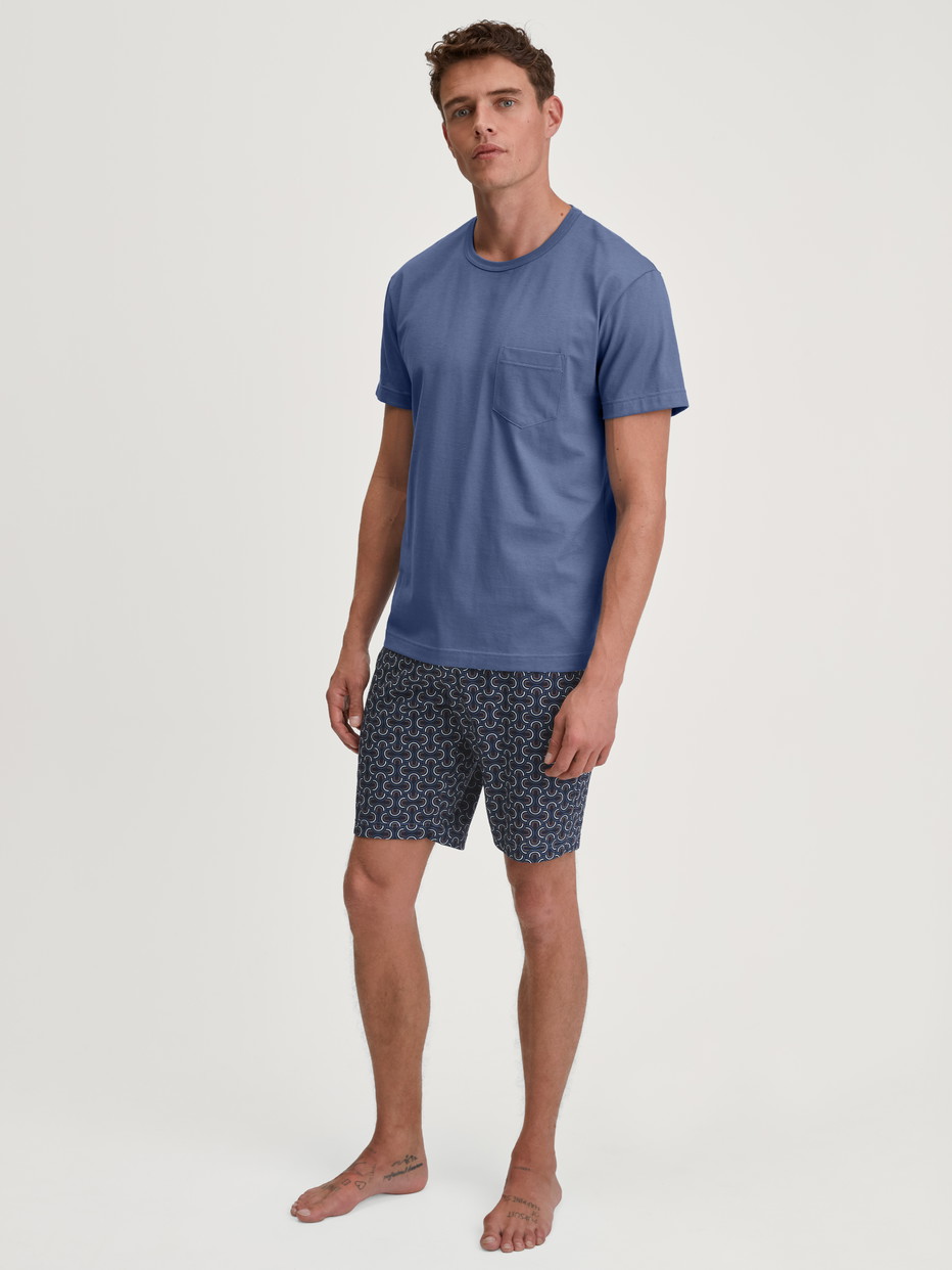 Men model is wearing Short pyjama made of 100% Cotton in Blue, Patterned from the Relax Imprint 1 series by CALIDA, Front view