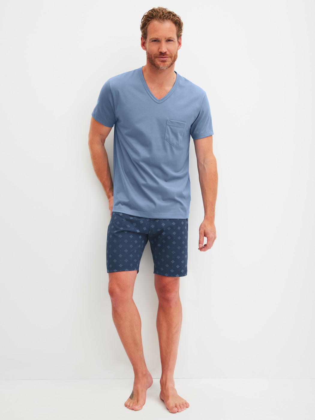 Men model is wearing Short pyjama made of 100% Cotton in Blue, Patterned from the Relax Imprint 2 series by CALIDA, Front view