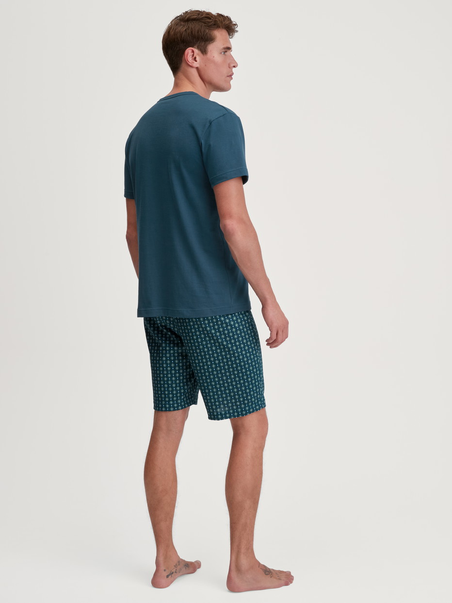 Men model is wearing Short pyjama made of 100% Cotton in Turquoise, Patterned from the Relax Imprint 3 series by CALIDA, Back view