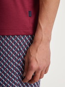 Men model is wearing Short pyjama made of 100% Cotton in Red, Patterned from the Relax Imprint series by CALIDA, Detail