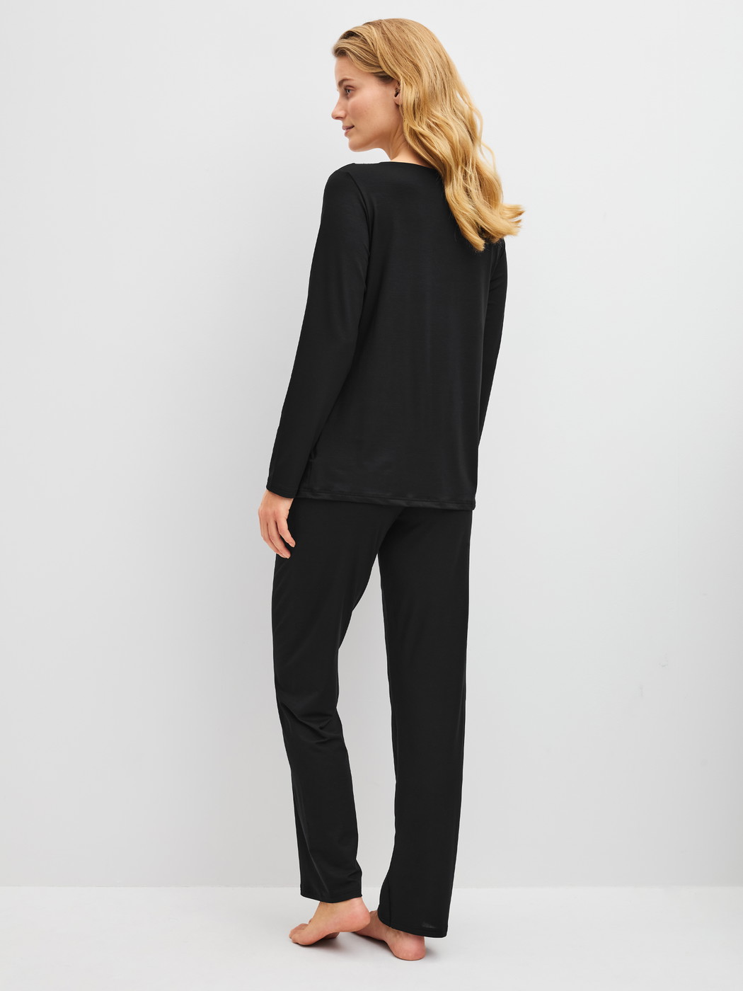 Women model is wearing  made of Modal in Black, Lace from the Elegant Dreams series by CALIDA, Back view