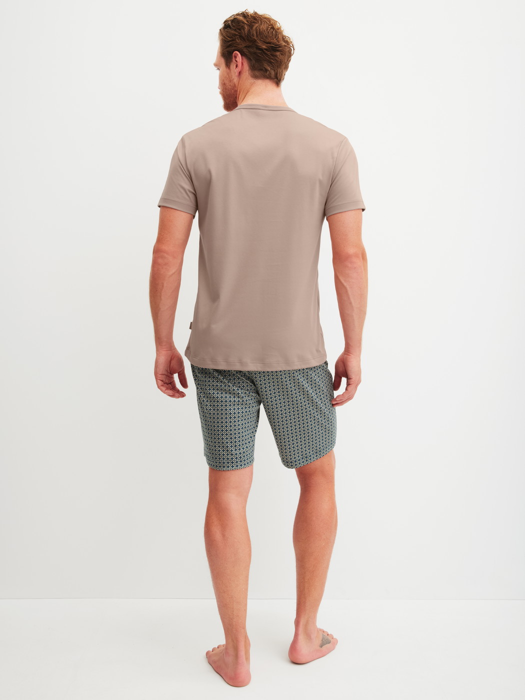 Men model is wearing short pyjamas made of 100% Cotton in Blue, Patterned from the Relax Choice 1 series by CALIDA, Back view