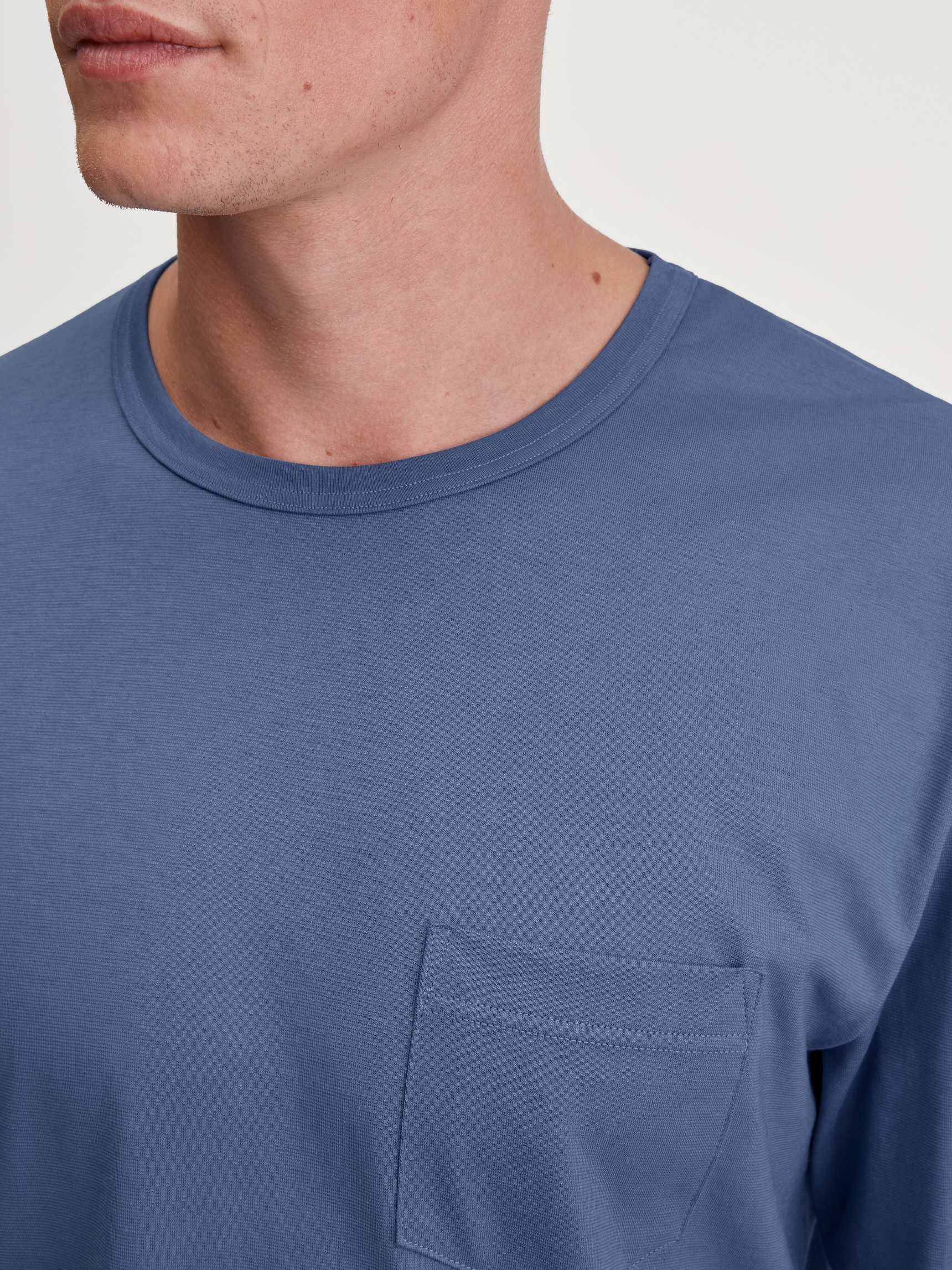 Men model is wearing Pyjamas, long made of 100% Cotton in Blue, Patterned from the Relax Imprint 1 series by CALIDA, Detail