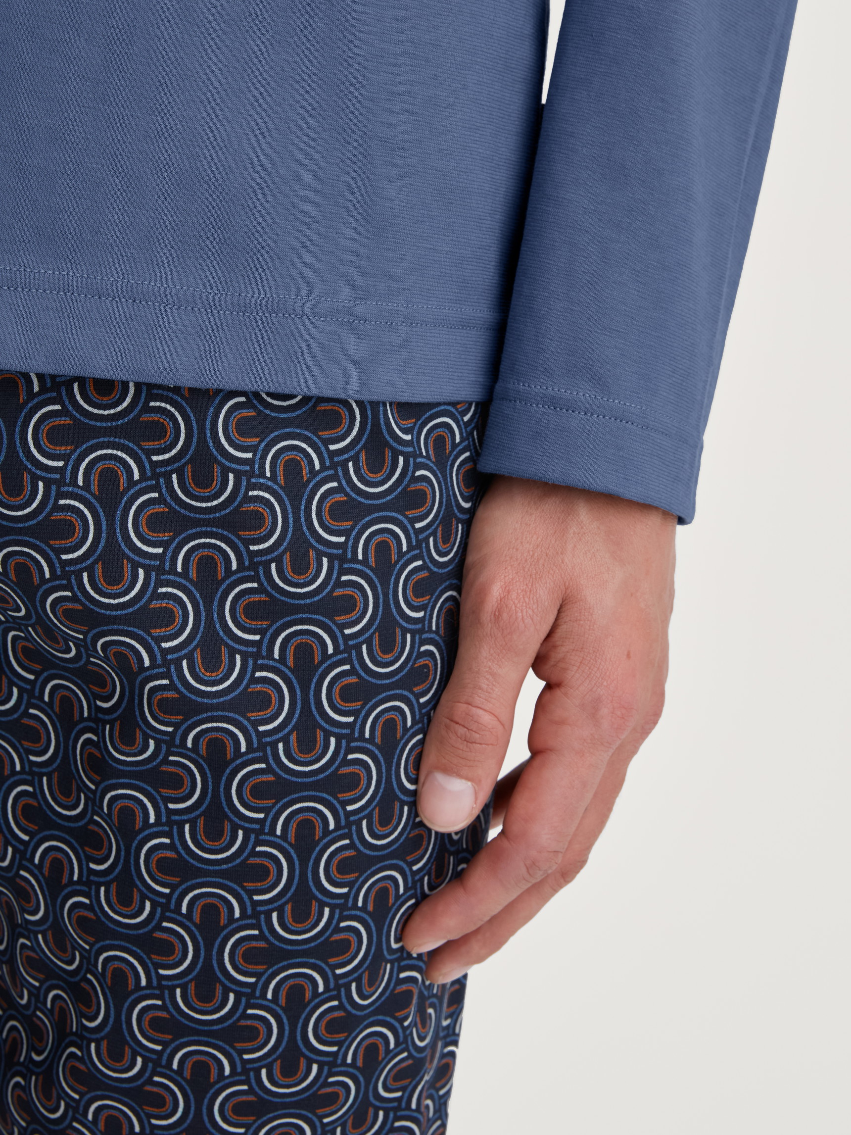 Men model is wearing Pyjamas, long made of 100% Cotton in Blue, Patterned from the Relax Imprint 1 series by CALIDA, Detail