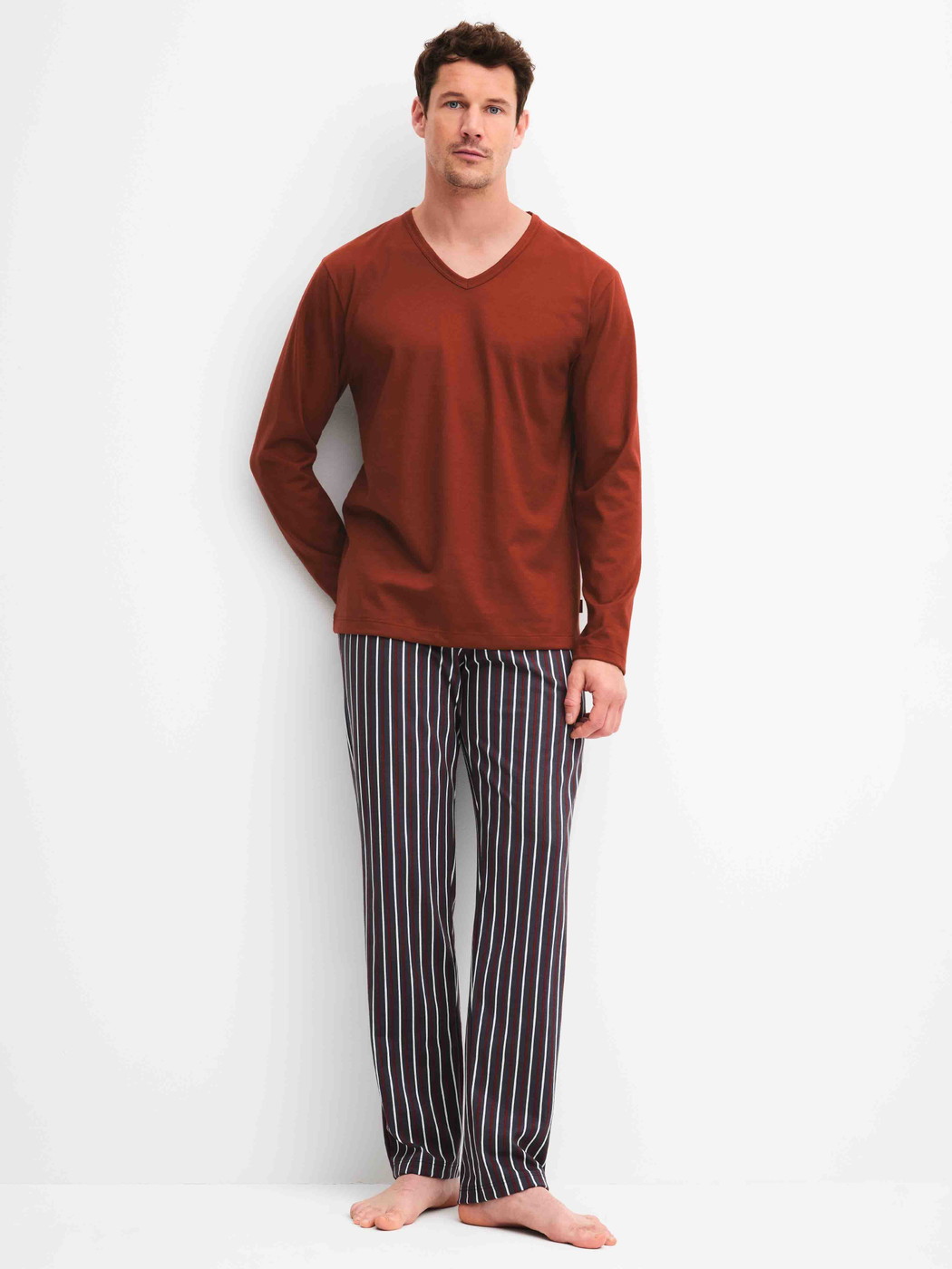 Men model is wearing Pyjamas, long made of 100% Cotton in Red, Patterned from the Cotton Special series by CALIDA, Front view