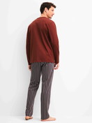 Men model is wearing Pyjamas, long made of 100% Cotton in Red, Patterned from the Cotton Special series by CALIDA, Back view