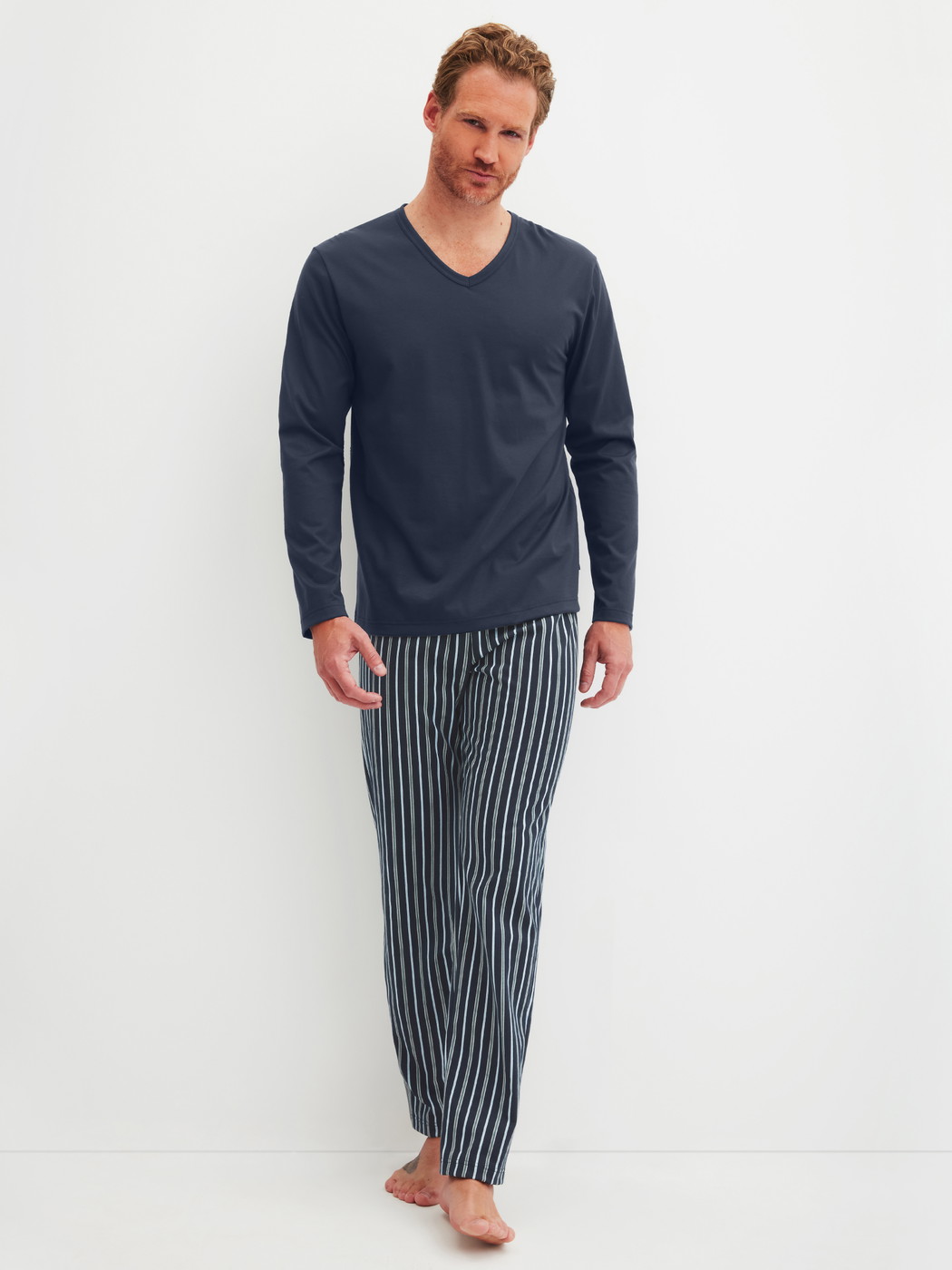Men model is wearing Pyjamas, long made of 100% Cotton in Blue, Striped from the Cotton Special series by CALIDA, Front view