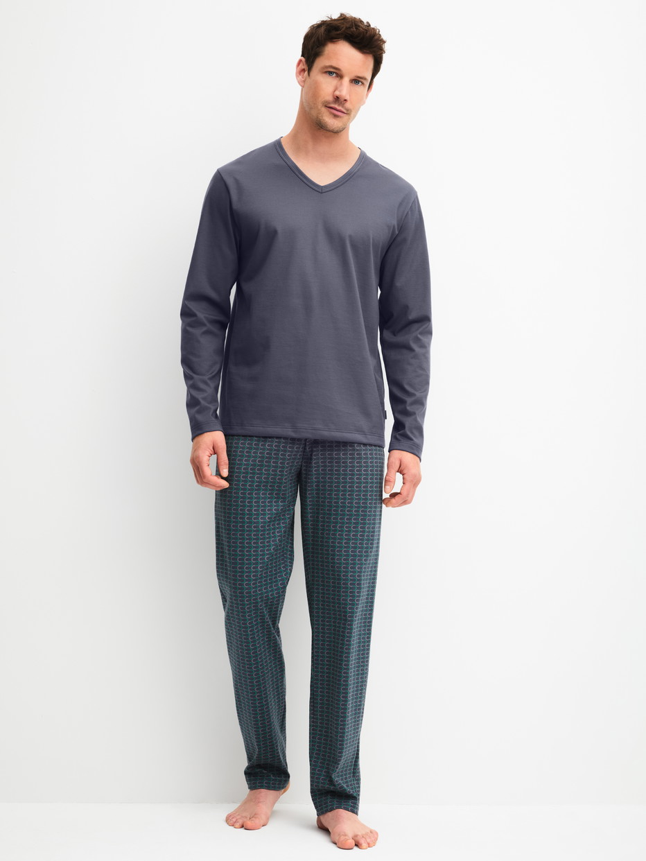 Men model is wearing Pyjamas, long made of 100% Cotton in Black, Patterned from the Cotton Special series by CALIDA, Front view