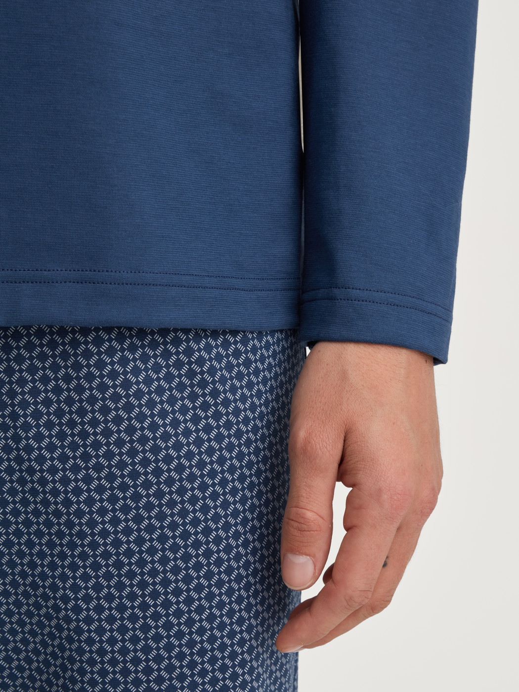 Men model is wearing Pyjamas, long made of 100% Cotton in Blue, Patterned from the Cotton Special series by CALIDA, Detail