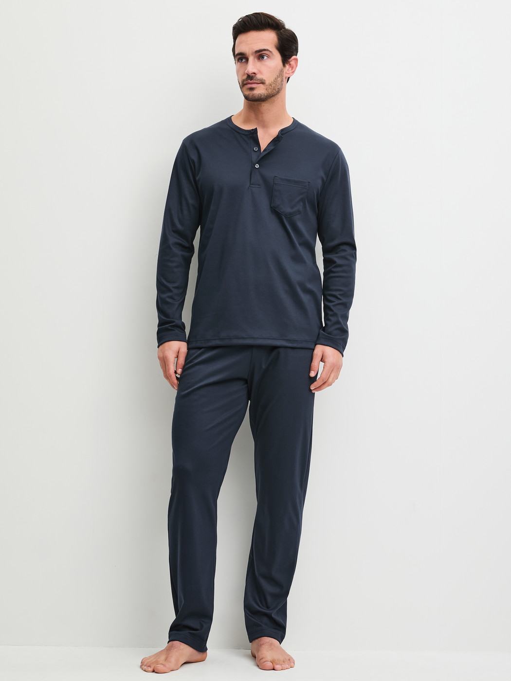 Men model is wearing Pyjamas made of 100% Cotton in Blue, Patterned from the EDITION 85 series by CALIDA, Front view