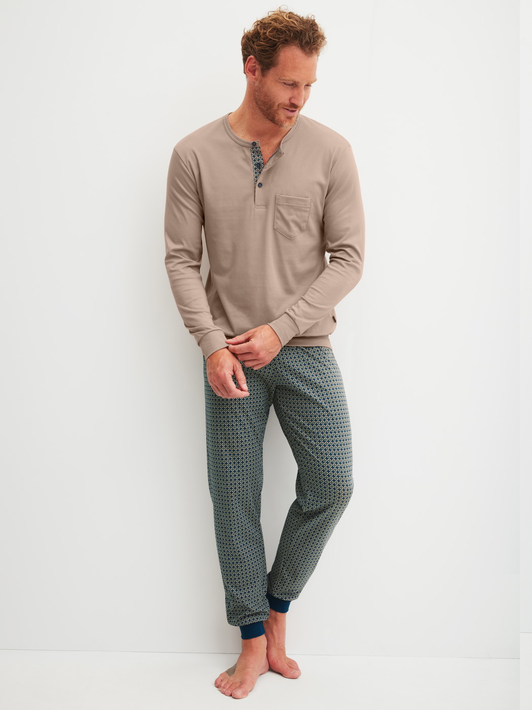 Men model is wearing cuffed pyjamas made of 100% Cotton in Blue, Patterned from the Relax Choice 1 series by CALIDA, Front view