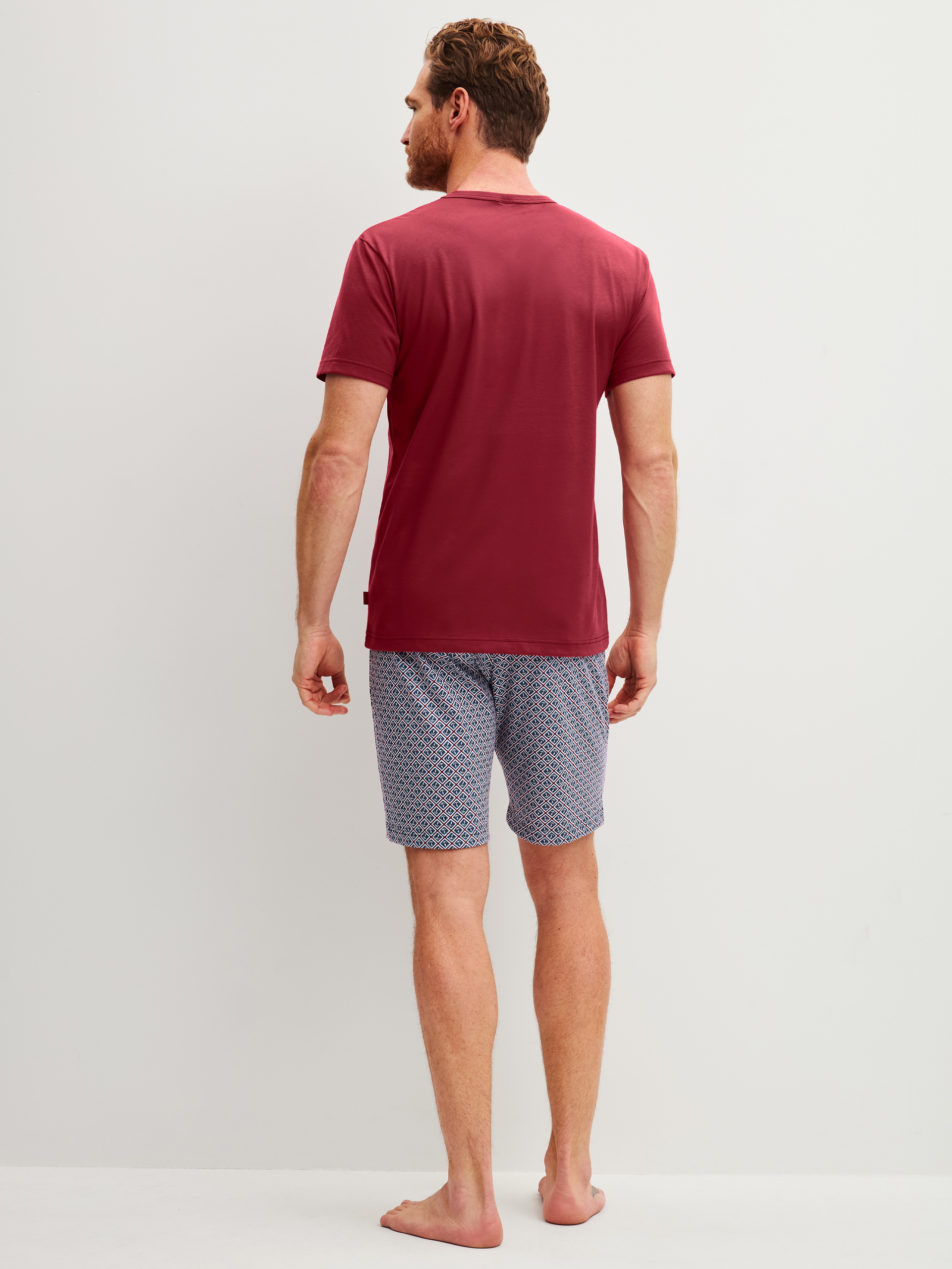 Men model is wearing Short pyjama made of 100% Cotton in Red, Patterned from the Cotton Special series by CALIDA, Back view
