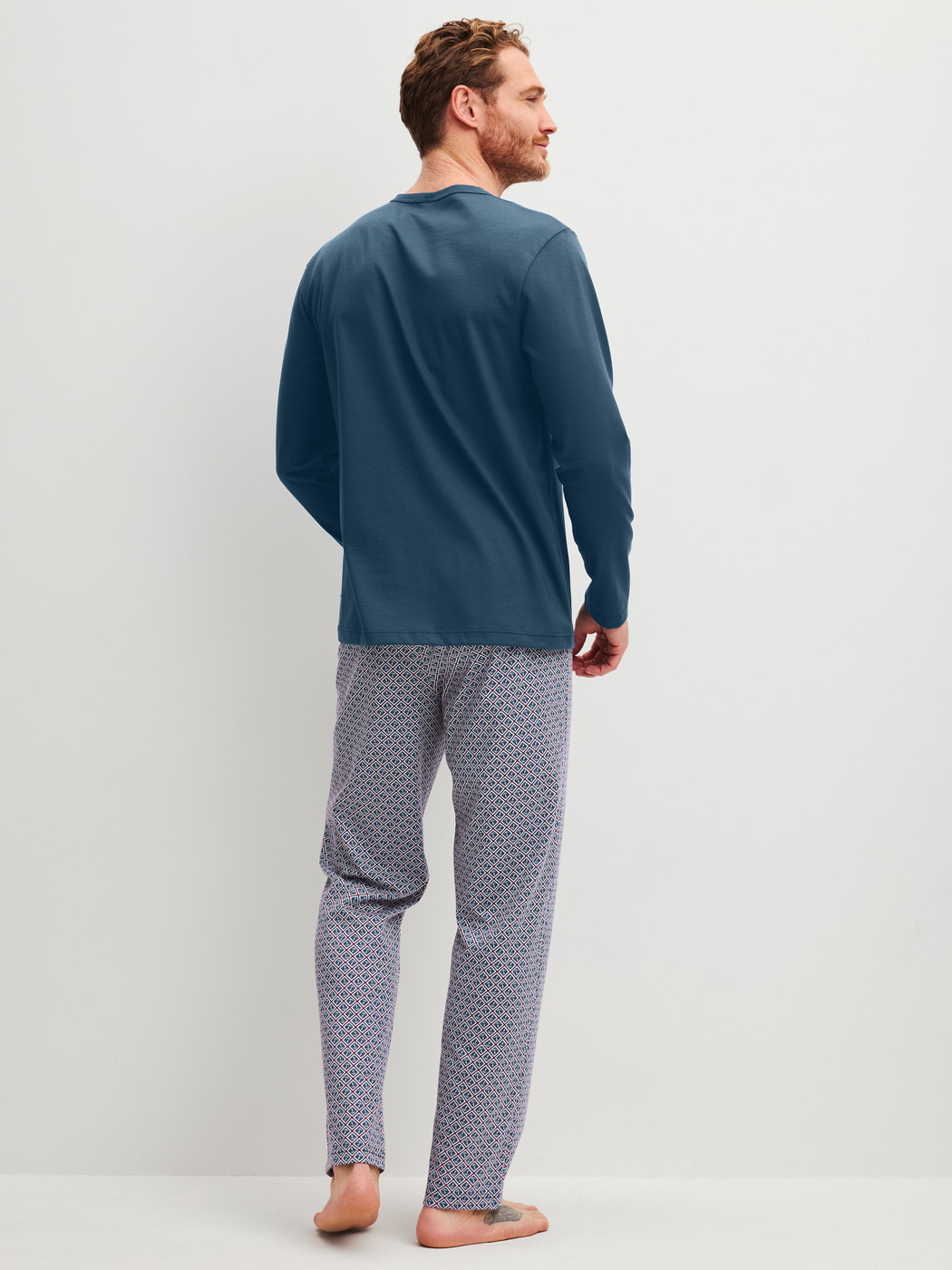 Men model is wearing Pyjama made of 100% Cotton in Blue, Patterned from the Cotton Special series by CALIDA, Back view