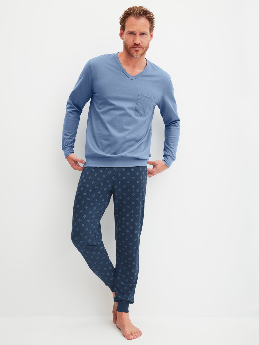 Men model is wearing Pyjama with cuff made of 100% Cotton in Blue, Patterned from the Relax Imprint 2 series by CALIDA, Front view