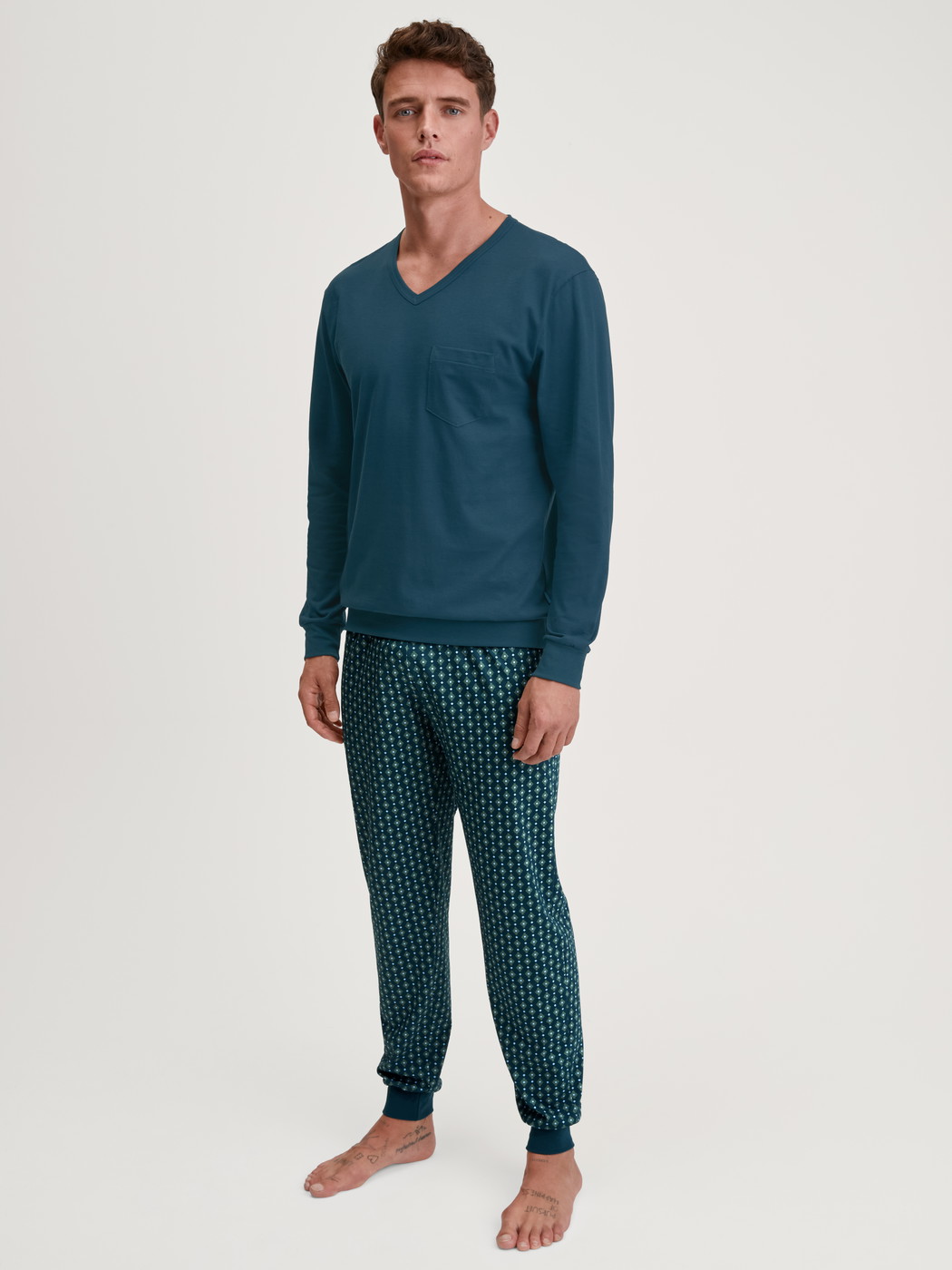 Men model is wearing Pyjama with cuff made of 100% Cotton in Turquoise, Patterned from the Relax Imprint 3 series by CALIDA, Front view