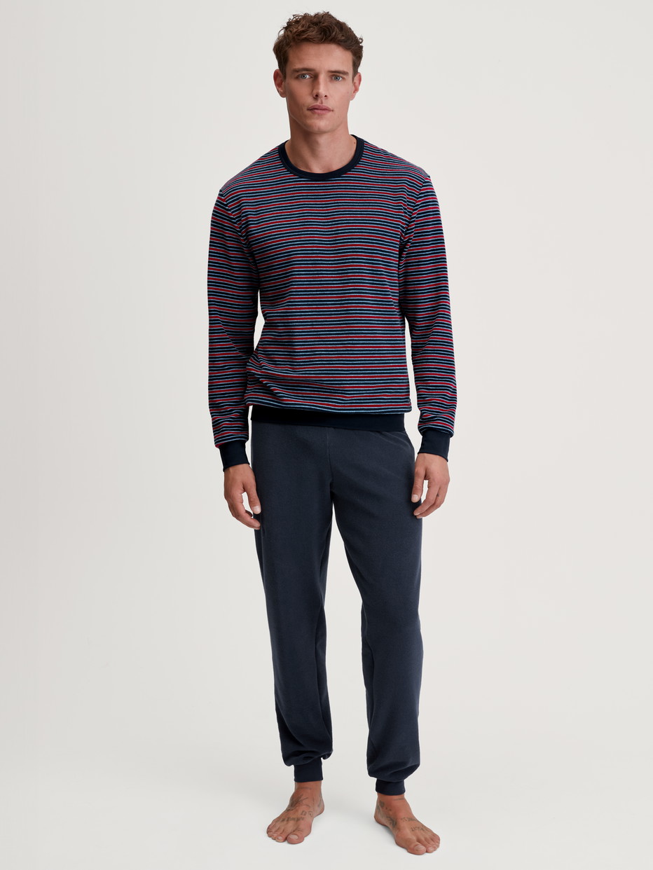 Men model is wearing Pyjama with cuff made of Cotton in Red, Striped from the Relax Terry series by CALIDA, Front view