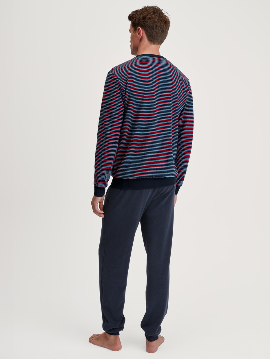 Men model is wearing Pyjama with cuff made of Cotton in Red, Striped from the Relax Terry series by CALIDA, Back view