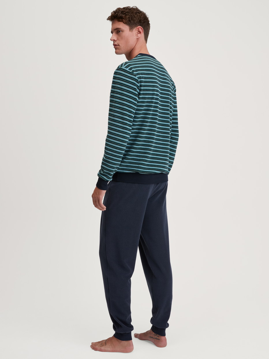 Men model is wearing Pyjama with cuff made of Cotton in Blue, Striped from the Relax Terry series by CALIDA, Back view