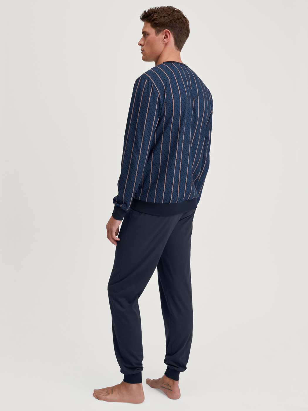 Men model is wearing Pyjama with cuff made of 100% Cotton in Blue, Striped from the Relax Imprint 1 series by CALIDA, Back view