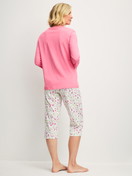 Women model is wearing Capri Pyjama made of 100% Cotton in Pink, Patterned from the Cotton Special series by CALIDA, Back view