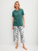 Women model is wearing 7/8 - Pyjamas made of 100% Cotton in Turquoise, Floral from the Botanic Dreams series by CALIDA, Front view