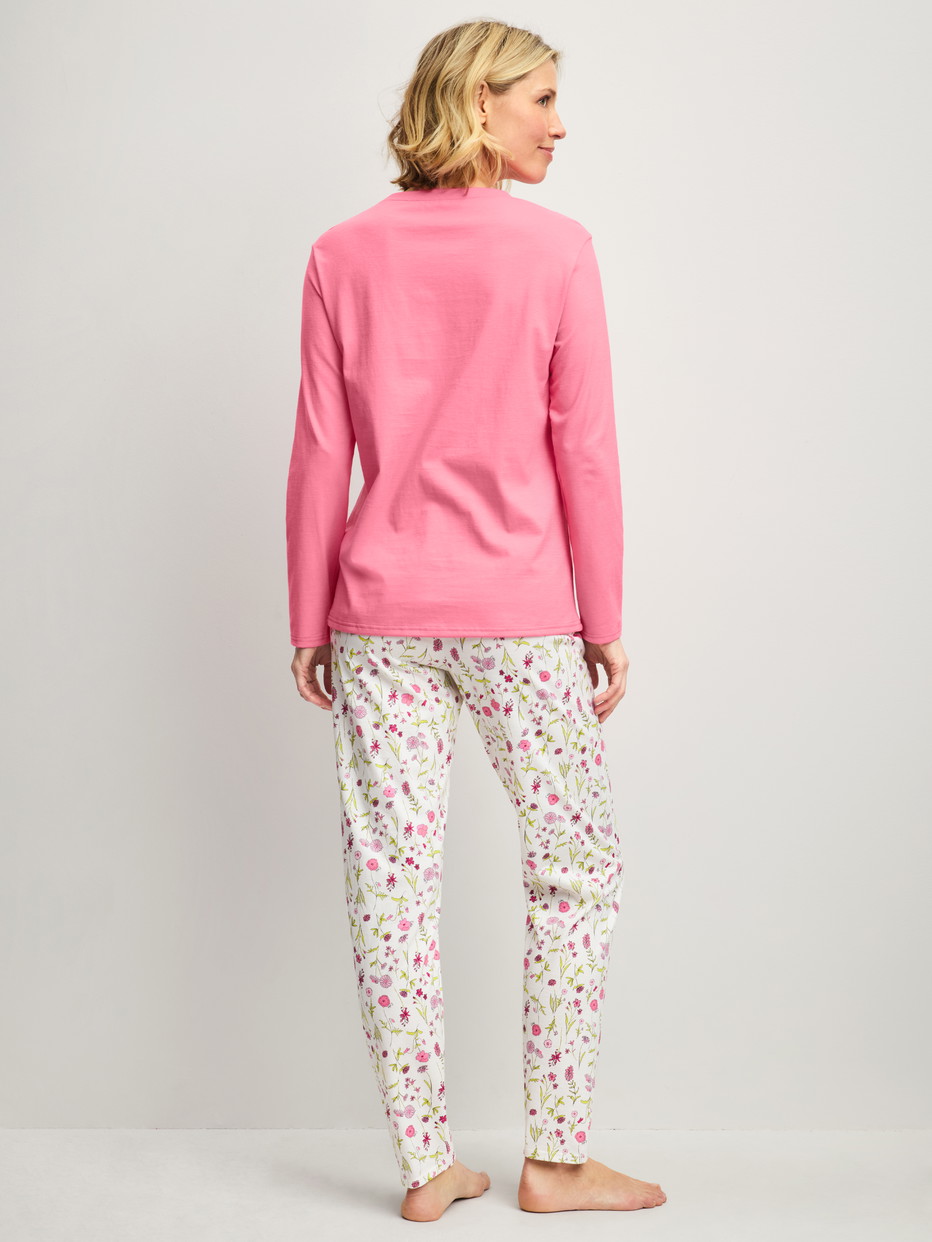 Women model is wearing Pyjamas, long made of 100% Cotton in Pink, Patterned from the Cotton Special series by CALIDA, Back view