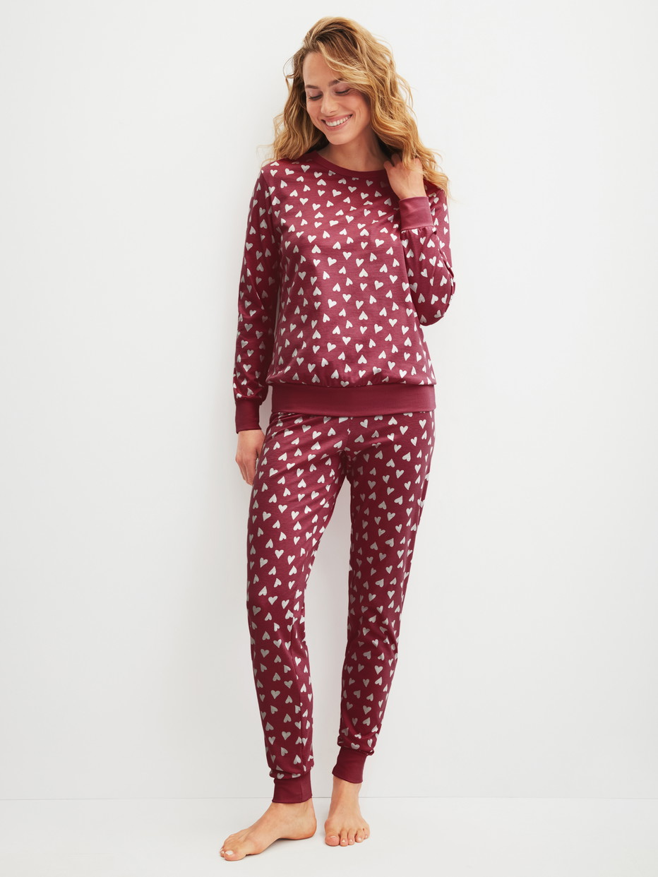 Women model is wearing Pyjama with cuff made of 100% Cotton in Red, Unicoloured from the Cotton Special series by CALIDA, Front view