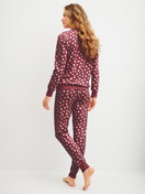 Women model is wearing Pyjama with cuff made of 100% Cotton in Red, Unicoloured from the Cotton Special series by CALIDA, Back view