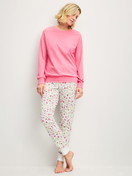 Women model is wearing Pyjama with cuff made of 100% Cotton in Pink, Patterned from the Cotton Special series by CALIDA, Front view