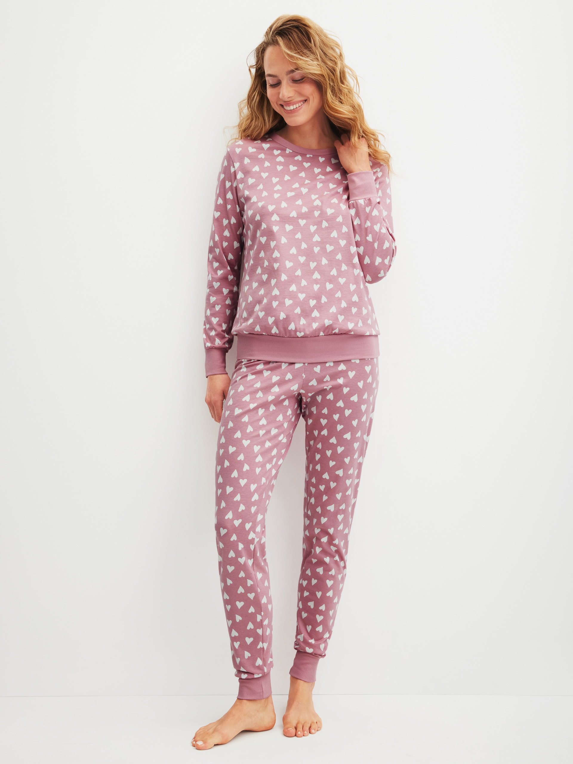 Women model is wearing Pyjama with cuff made of 100% Cotton in Pink, Patterned from the Cotton Special series by CALIDA, Front view