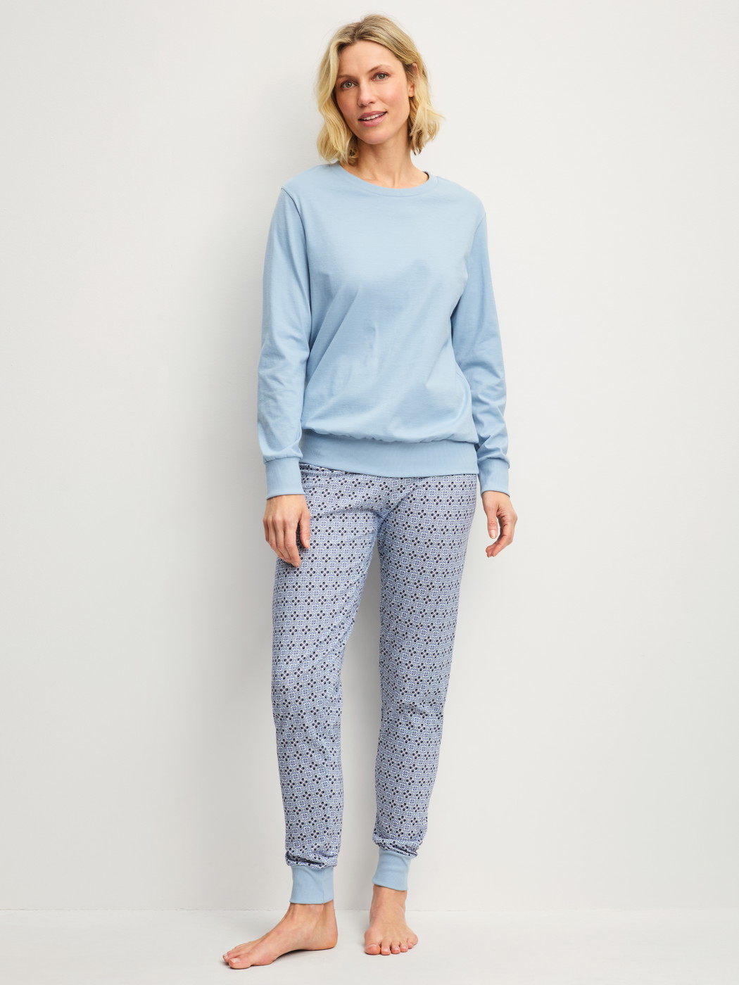 Women model is wearing Pyjama with cuff made of 100% Cotton in Grey, Patterned from the Cotton Special series by CALIDA, Front view