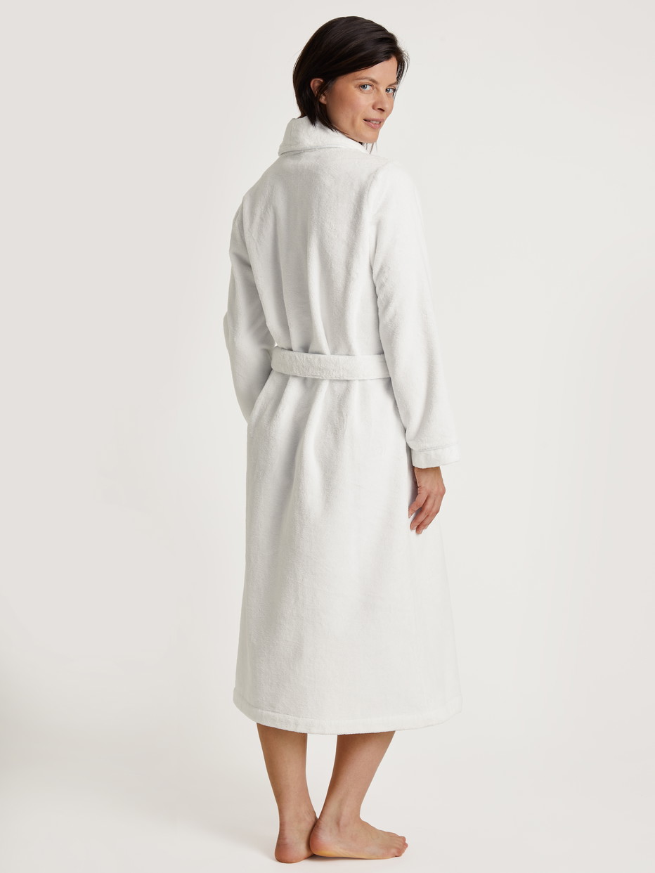 Women model is wearing Bathrobe made of Cotton in White, Unicoloured from the Cosy Shower series by CALIDA, Back view